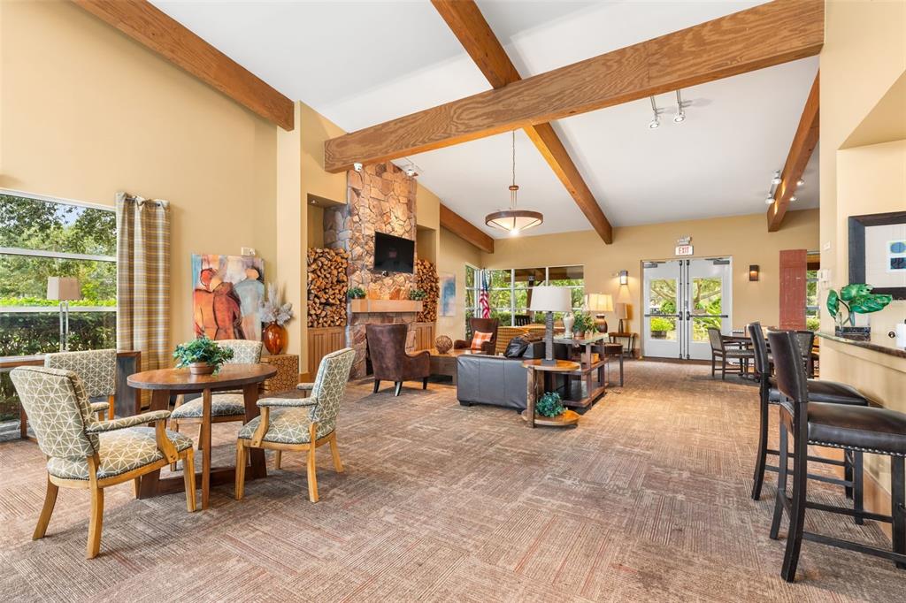 4098 Southwest 47th Court Ocala, FL 34474 - Photo 37 of 44 a view of a dining room with furniture one side kitchen view and a large window