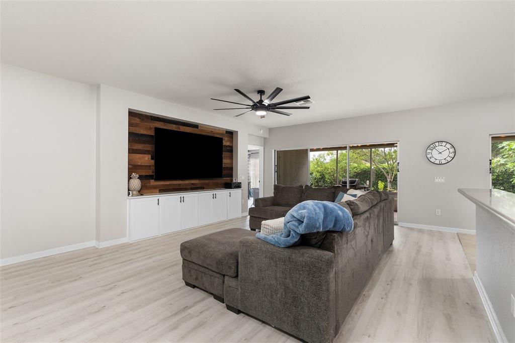 4098 Southwest 47th Court Ocala, FL 34474 - Photo 4 of 44 a living room with furniture and a flat screen tv