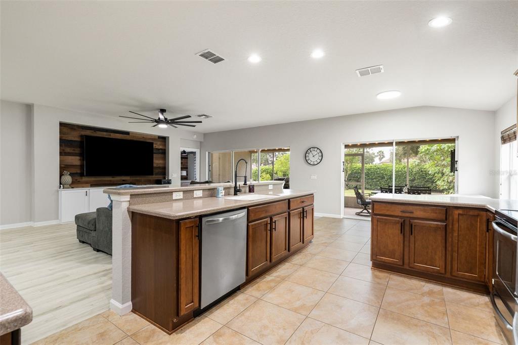 4098 Southwest 47th Court Ocala, FL 34474 - Photo 8 of 44 a large kitchen with stainless steel appliances a stove and a microwave
