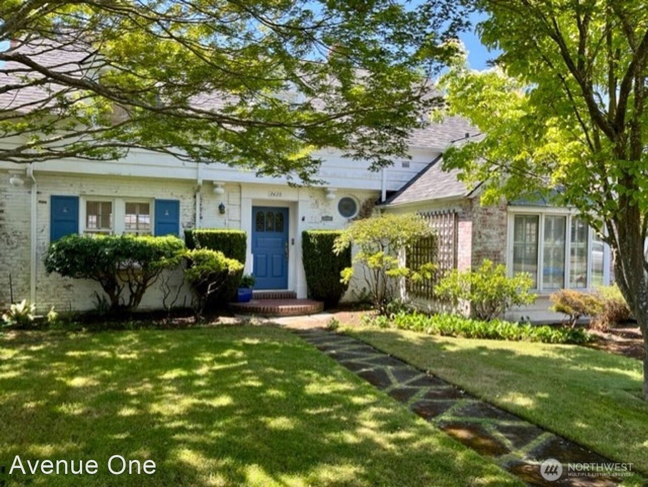 2425 43rd Avenue West Seattle, WA 98199 - Photo 1 of 1 a front view of a house with a yard