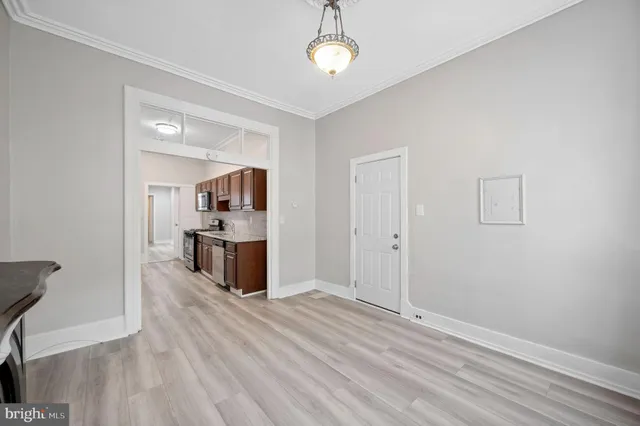 a view of a kitchen cabinets and wooden floor