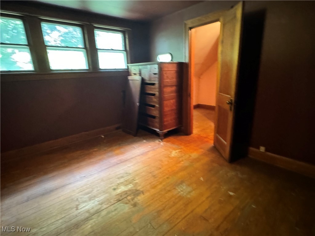 4034 North Bend Road Ashtabula, OH 44004 - Photo 12 of 29 Unfurnished bedroom featuring hardwood / wood-style floors
