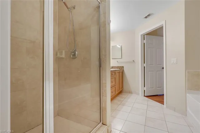 a bathroom with a shower and a sink