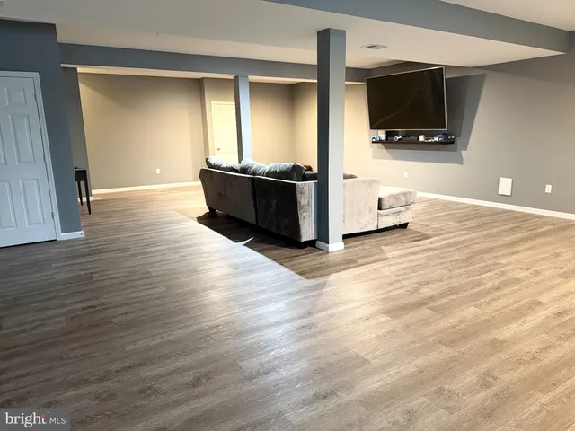 a view of a livingroom with wooden floor