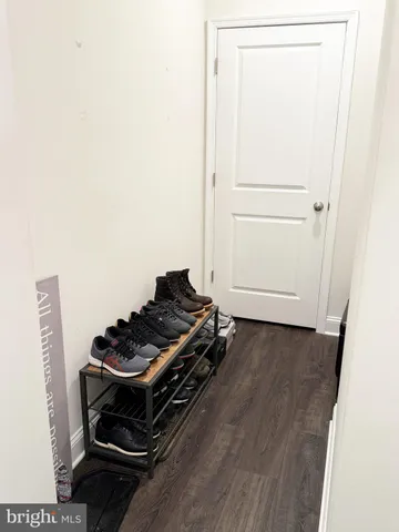 a room with a stove and a refrigerator