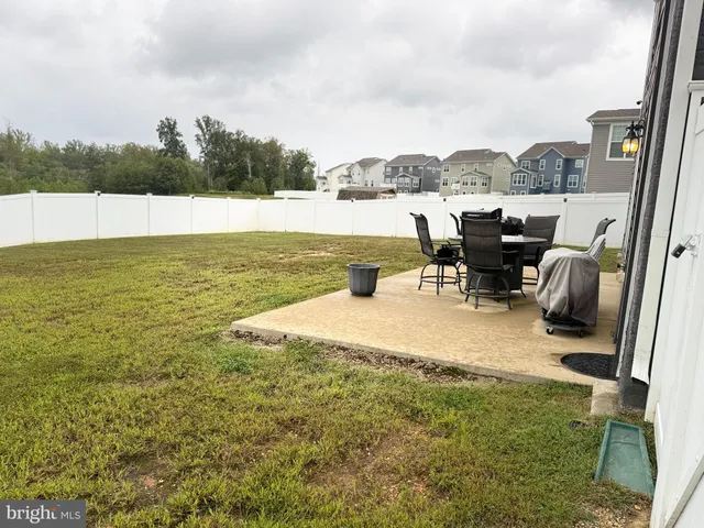 a view of a swimming pool with lawn chairs