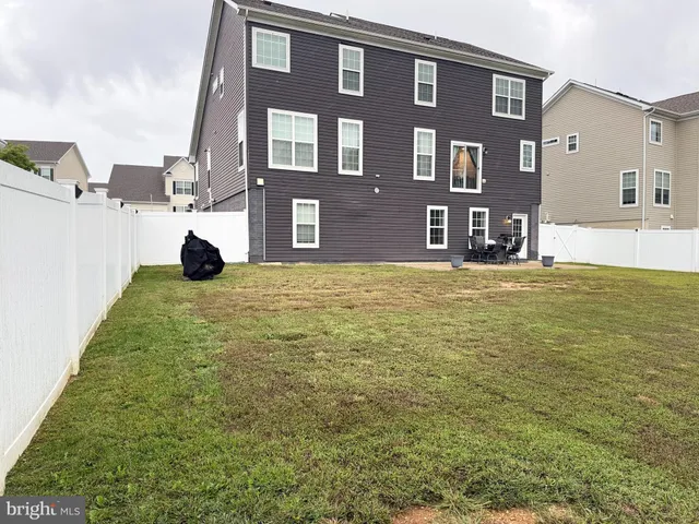 a view of pool with yard