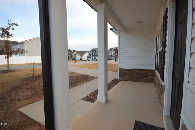 a view of a room with a floor to ceiling window