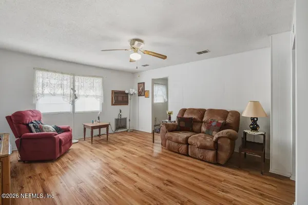 a living room with furniture and a window