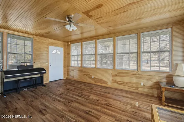 a view of an empty room with a window