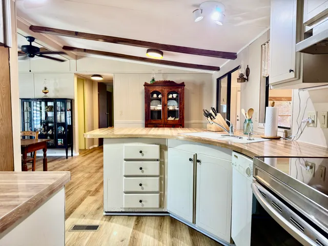 a dining room with furniture window and wooden floor