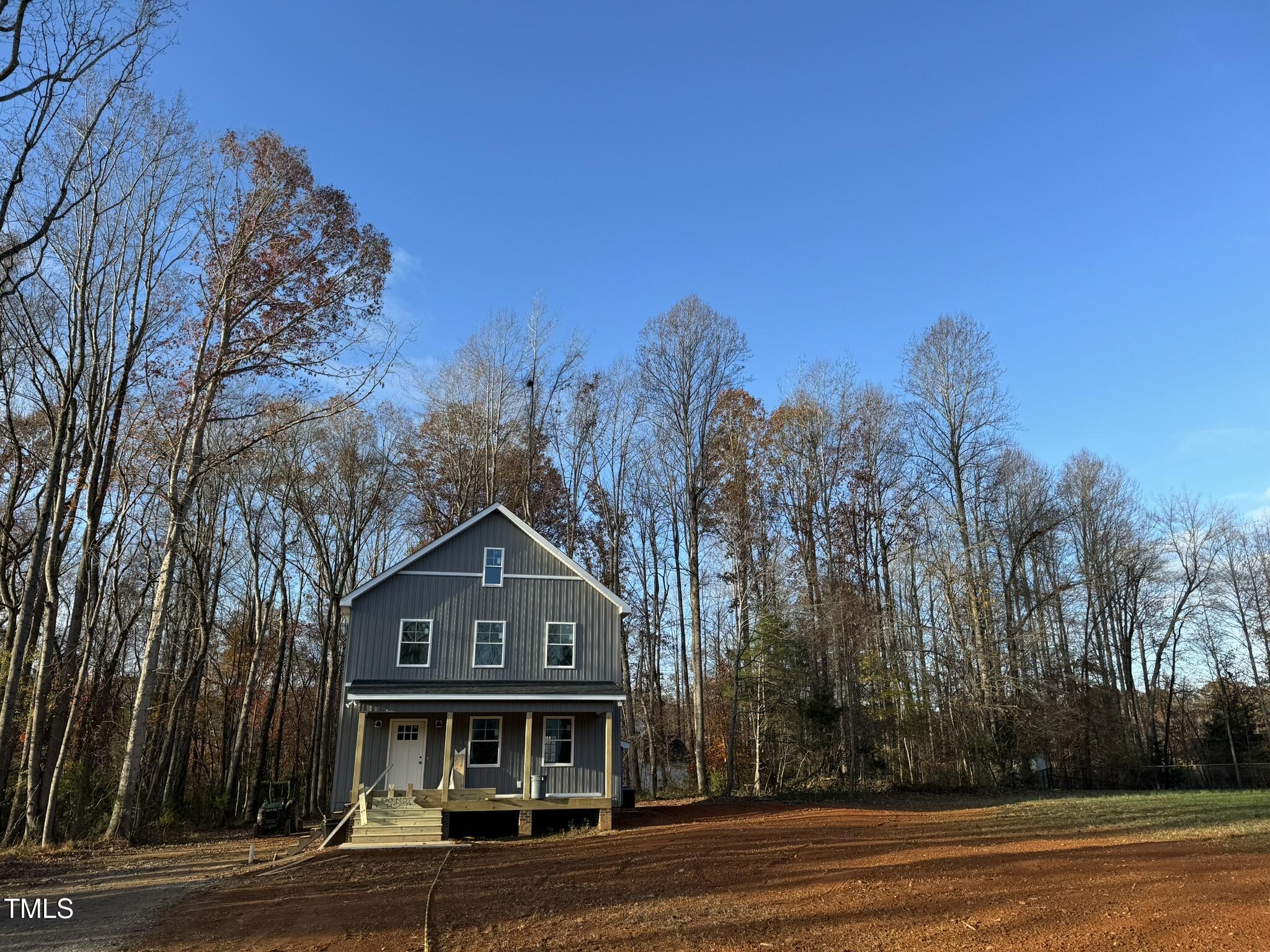 9518 Meredith Drive Rougemont, NC 27572 - Photo 2 of 12 a front view of a house with a yard