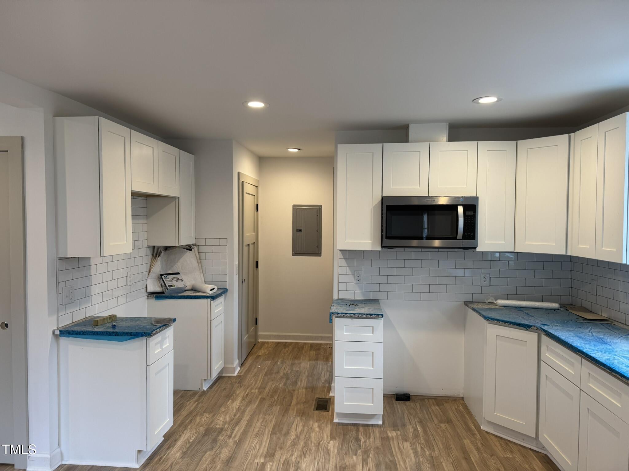 9518 Meredith Drive Rougemont, NC 27572 - Photo 6 of 12 a kitchen with stainless steel appliances granite countertop a sink stove and microwave