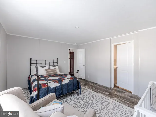 a bed room with a bed and a window