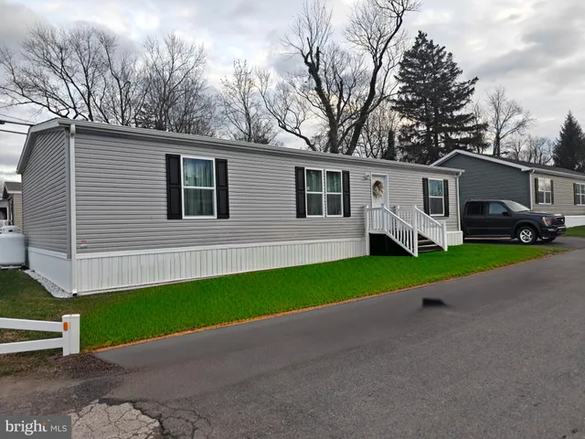 a view of a house with a back yard