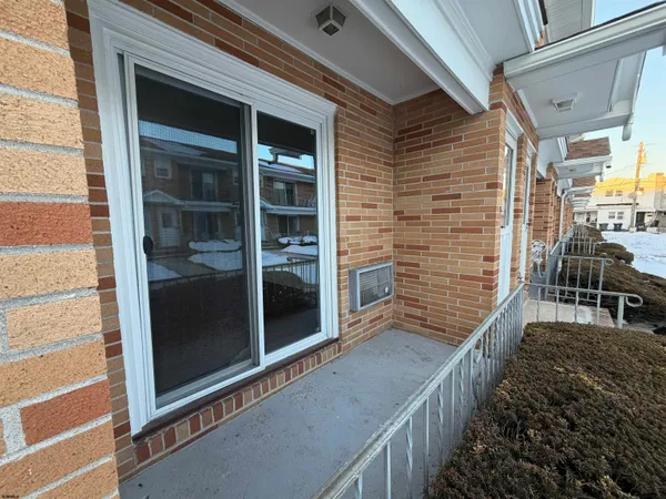 a view of front door and bedroom