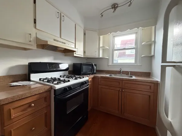 a kitchen with a stove and a sink