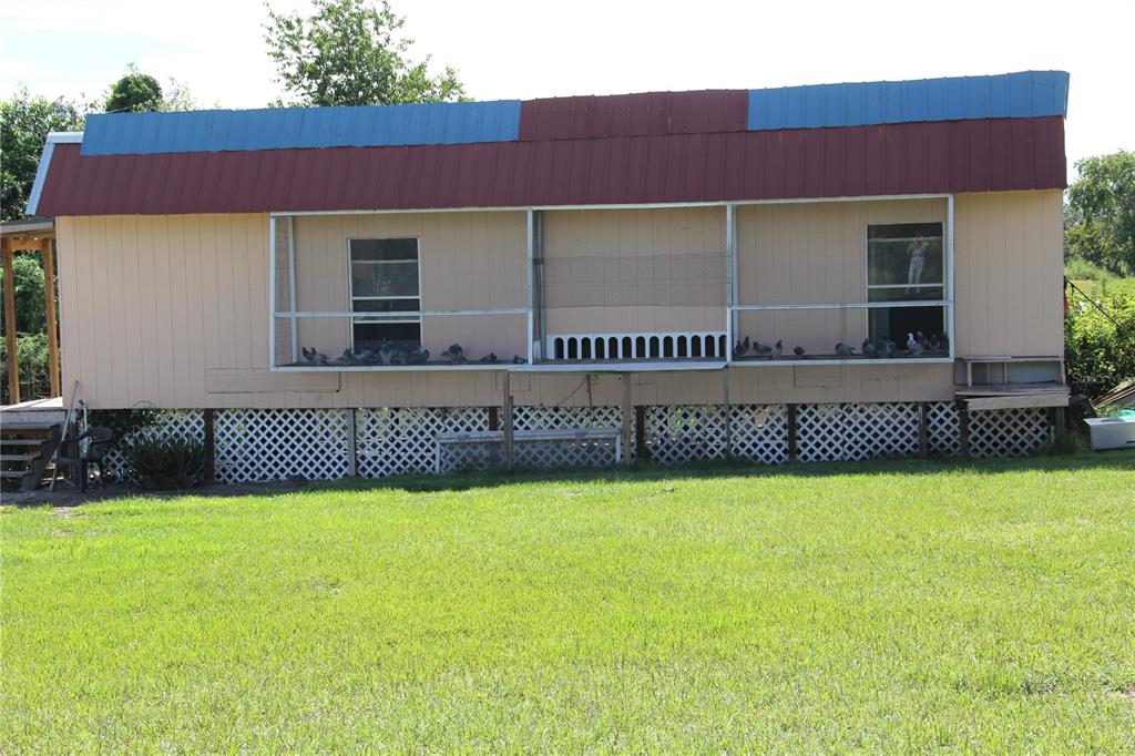 13127 Star Road Brooksville, FL 34613 - Photo 54 of 54 a view of a house with a yard