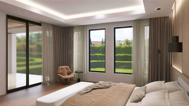 a bedroom with a bed and a large window