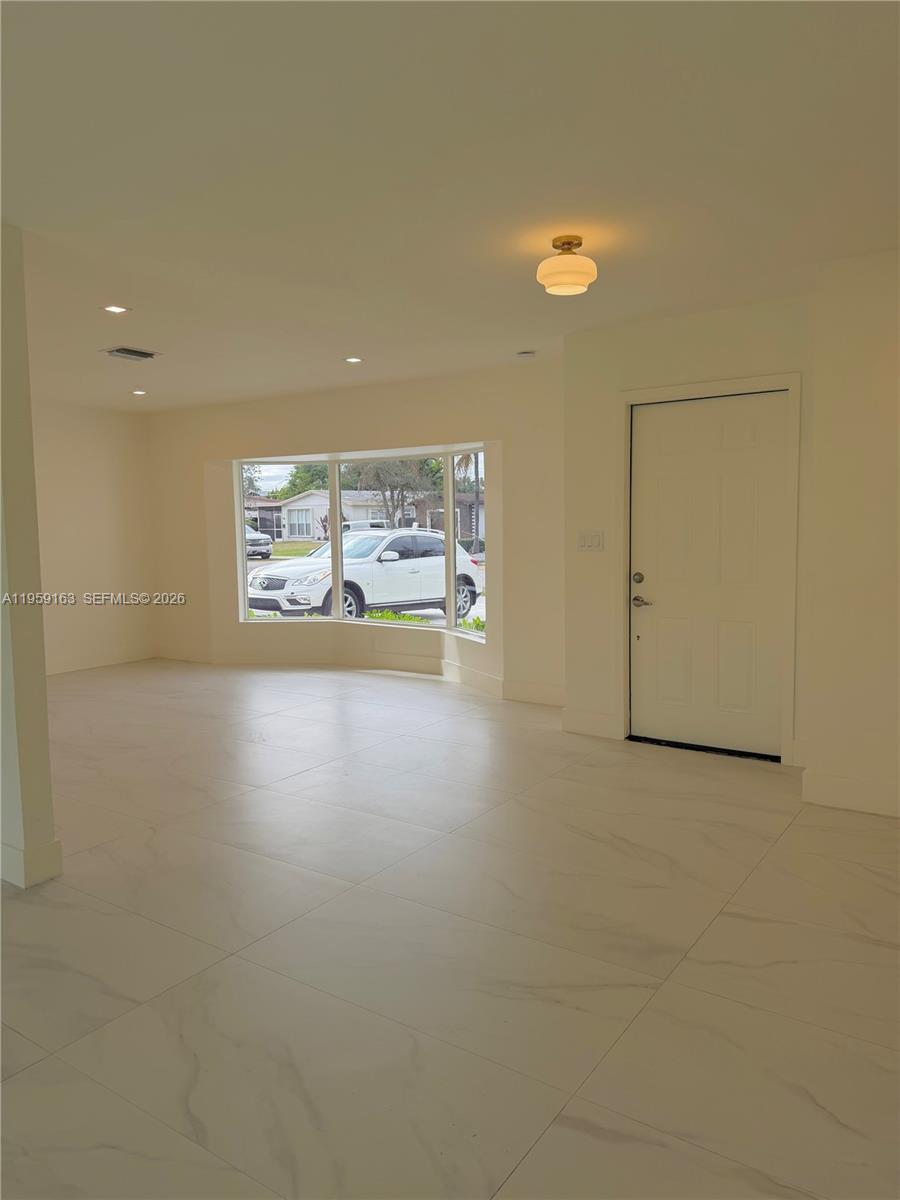 19221 Southwest 92nd Road Cutler Bay, FL 33157 - Photo 6 of 30 a view of an empty room with a window