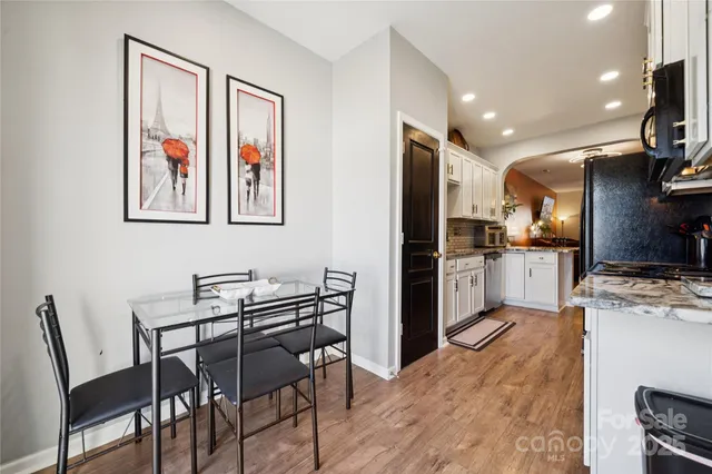 a view of kitchen with cabinets and wooden floor