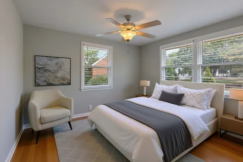 a bedroom with a bed and a couch