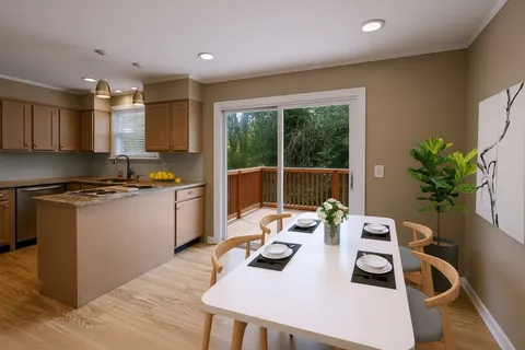 a kitchen with a table and chairs in it