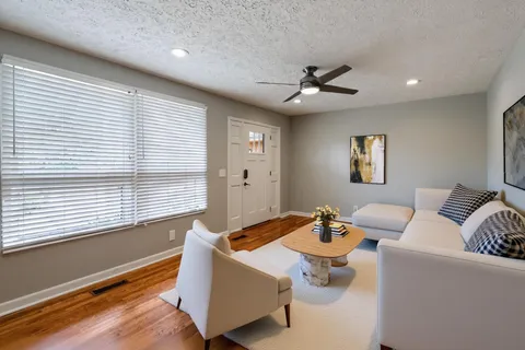 a living room with furniture and a window