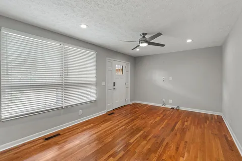 a view of an empty room with a window