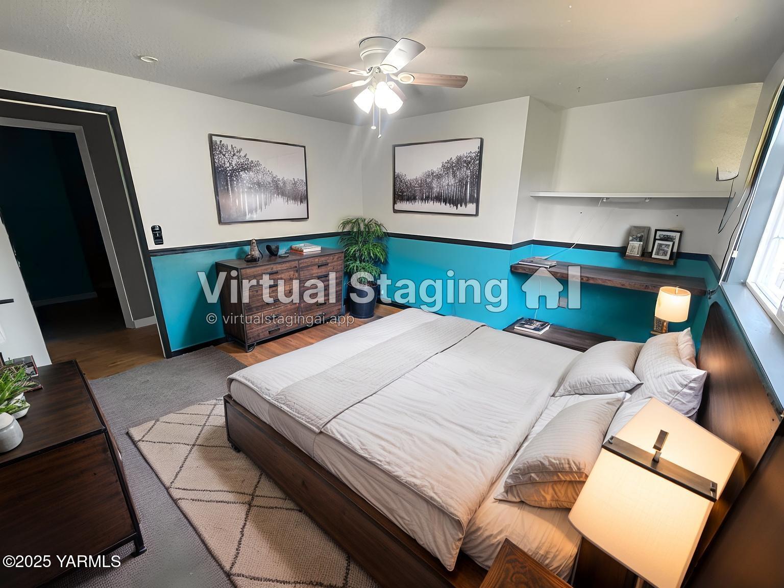 1602 Stein Road Yakima, WA 98908 - Photo 18 of 29 a bedroom with a bed and a chandelier