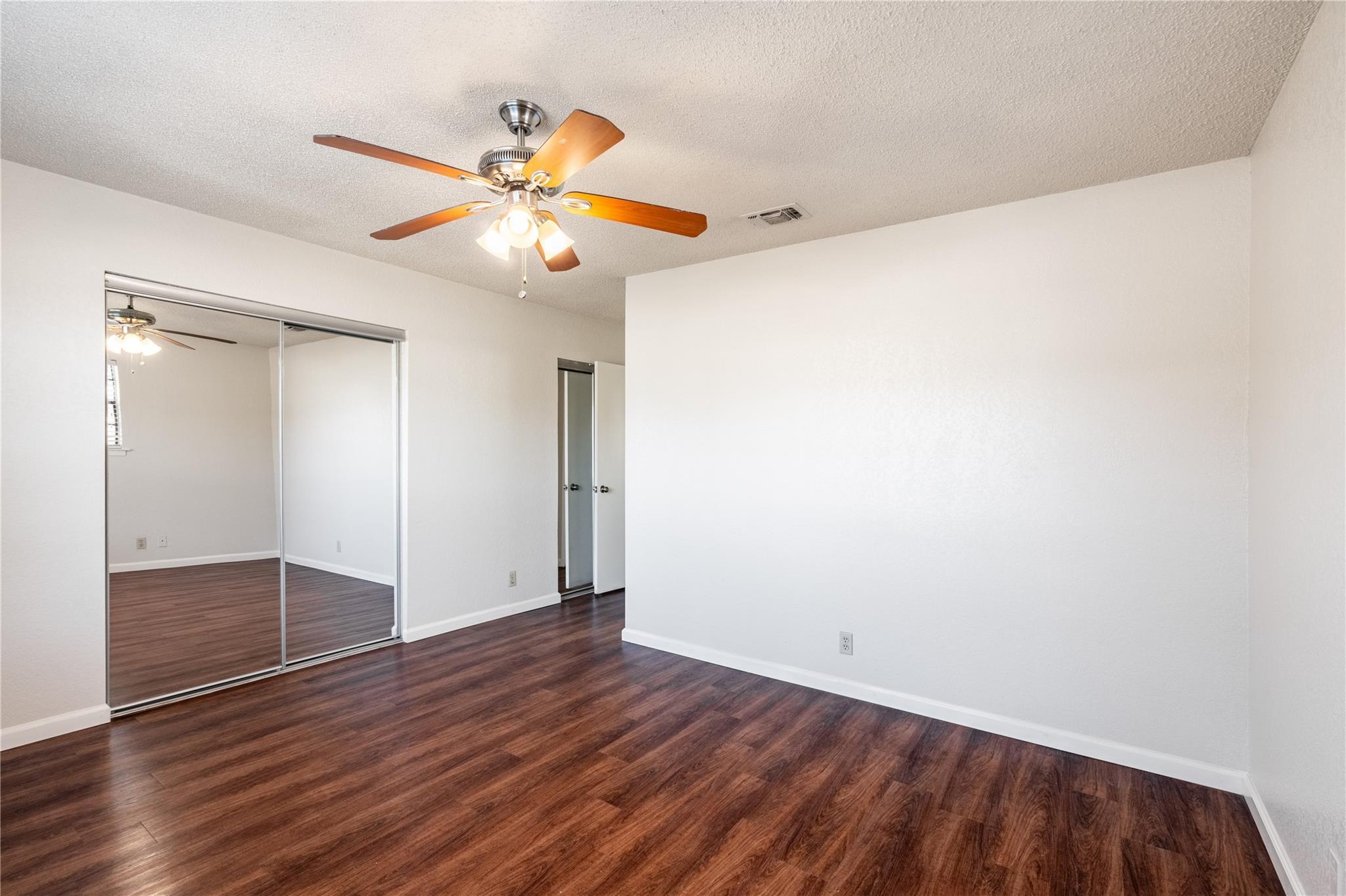 3800 Foust Trail, Unit B Georgetown, TX 78628 - Photo 13 of 16 Laminate flooring and bright white walls offer a neutral canvas for personalization in this versatile room.