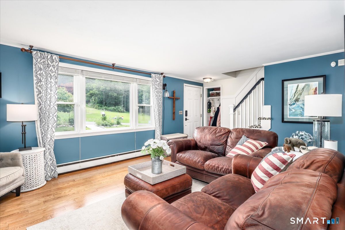 31 Aspen Mill Road Ridgefield, CT 06877 - Photo 5 of 38 Oversized windows make this front room bright & welcoming