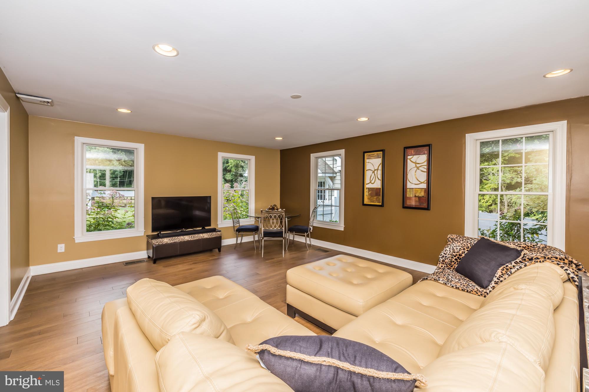 11 Hawk Hill Road Downingtown, PA 19335 - Photo 21 of 64 a spacious bedroom with a bed and glass windows