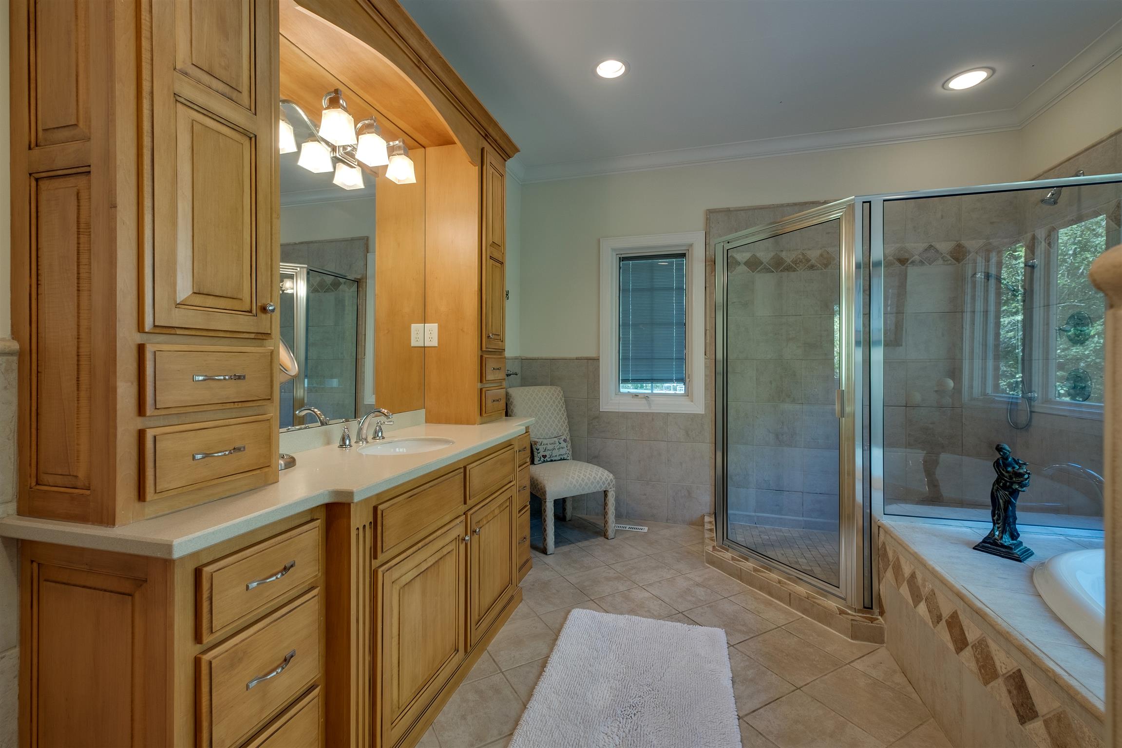 7446 River Rd Pike Nashville, TN 37209 - Photo 17 of 30 a spacious bathroom with a granite countertop sink mirror and shower