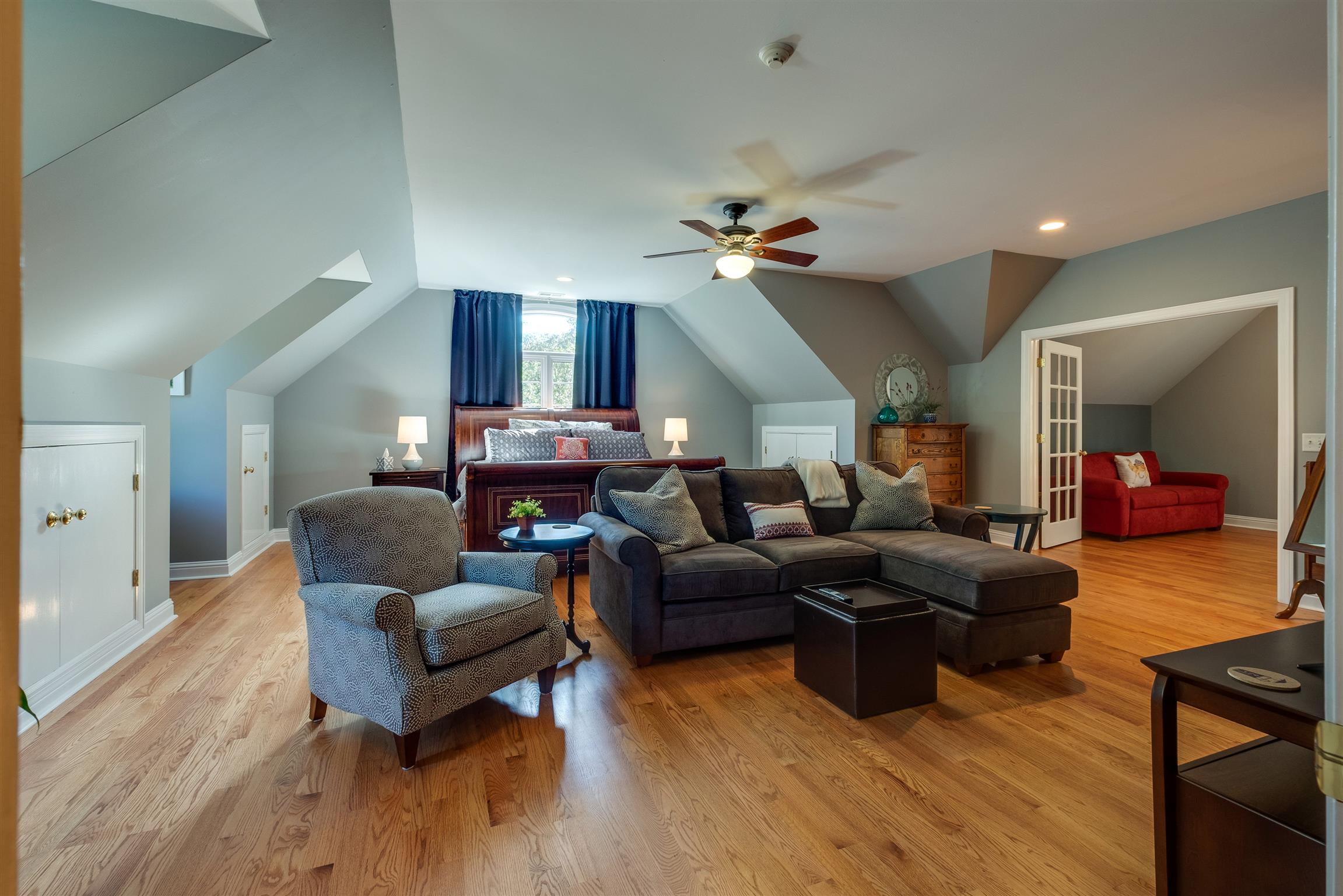 7446 River Rd Pike Nashville, TN 37209 - Photo 19 of 30 a living room with furniture a ceiling fan and a wooden floor