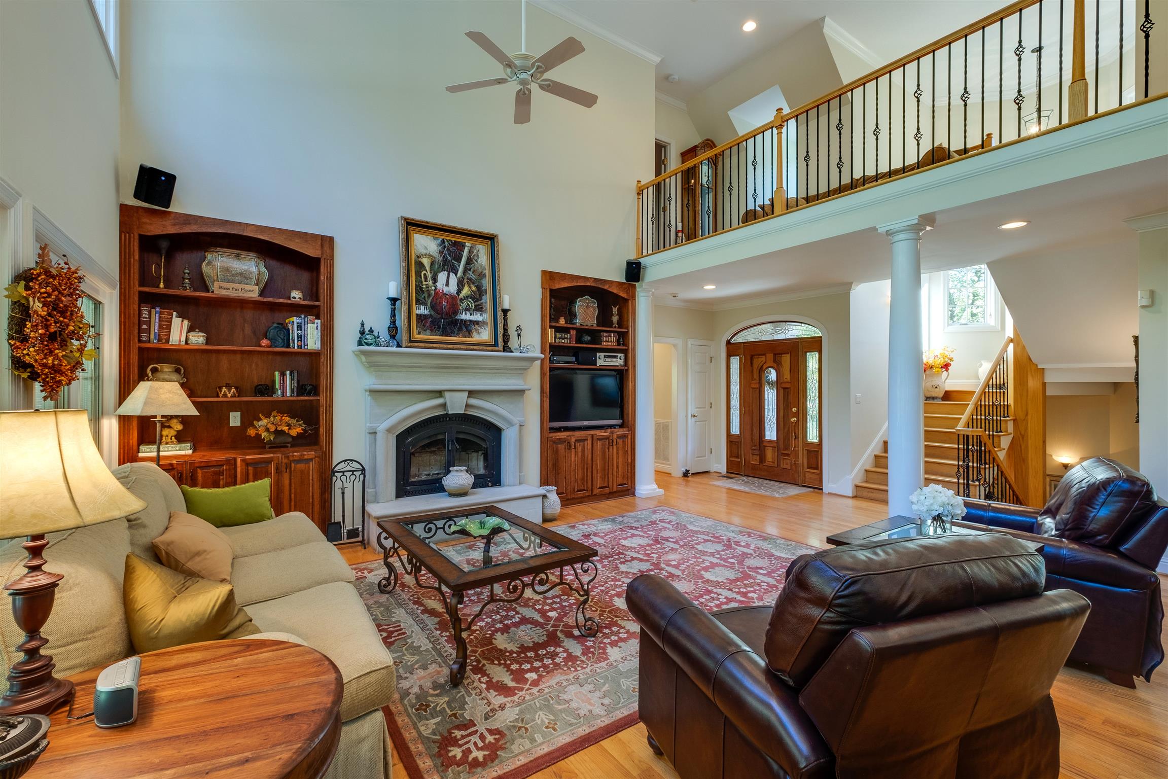 7446 River Rd Pike Nashville, TN 37209 - Photo 7 of 30 a living room with furniture a flat screen tv and a fireplace
