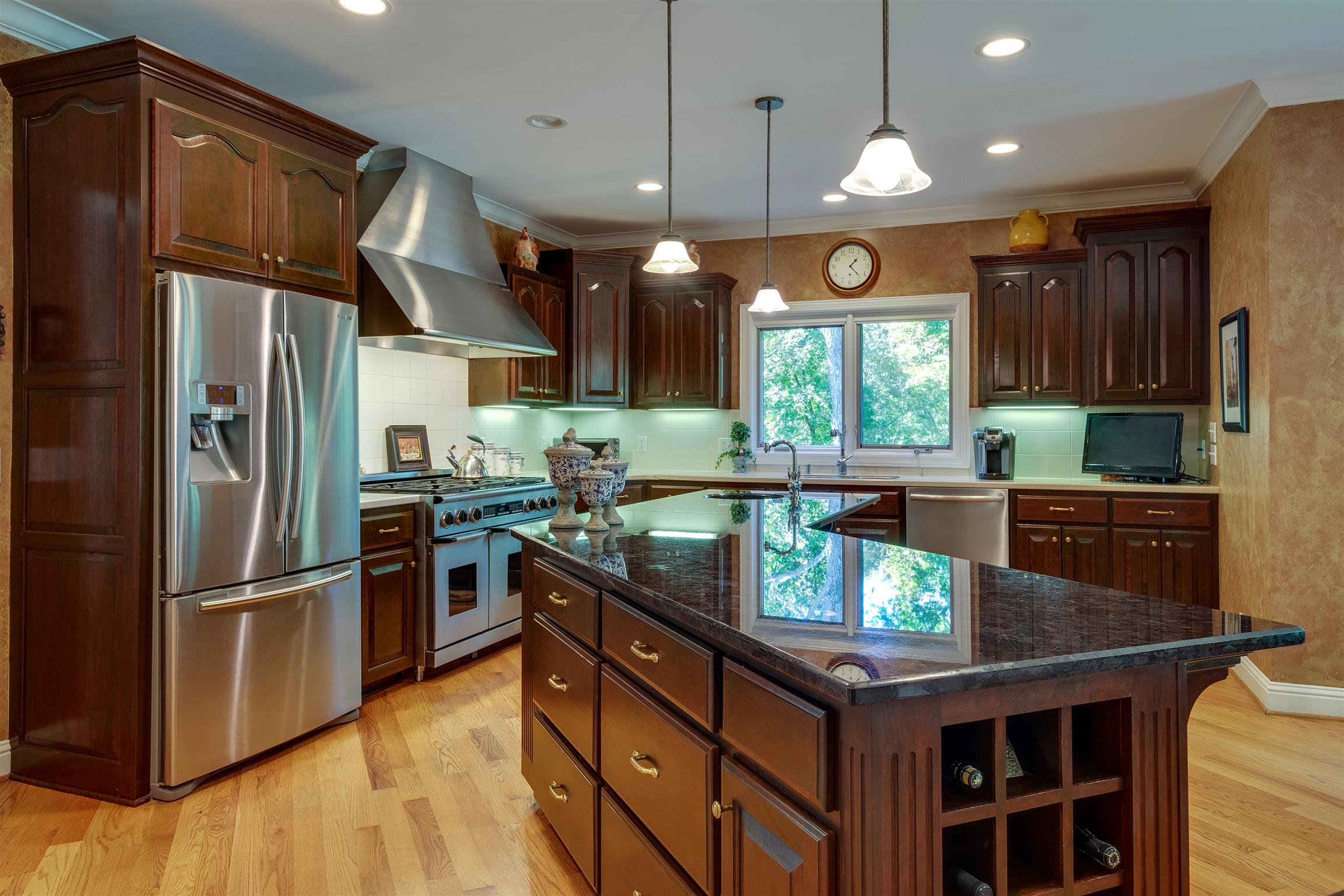 7446 River Rd Pike Nashville, TN 37209 - Photo 8 of 30 a kitchen with stainless steel appliances granite countertop a stove a refrigerator and a sink