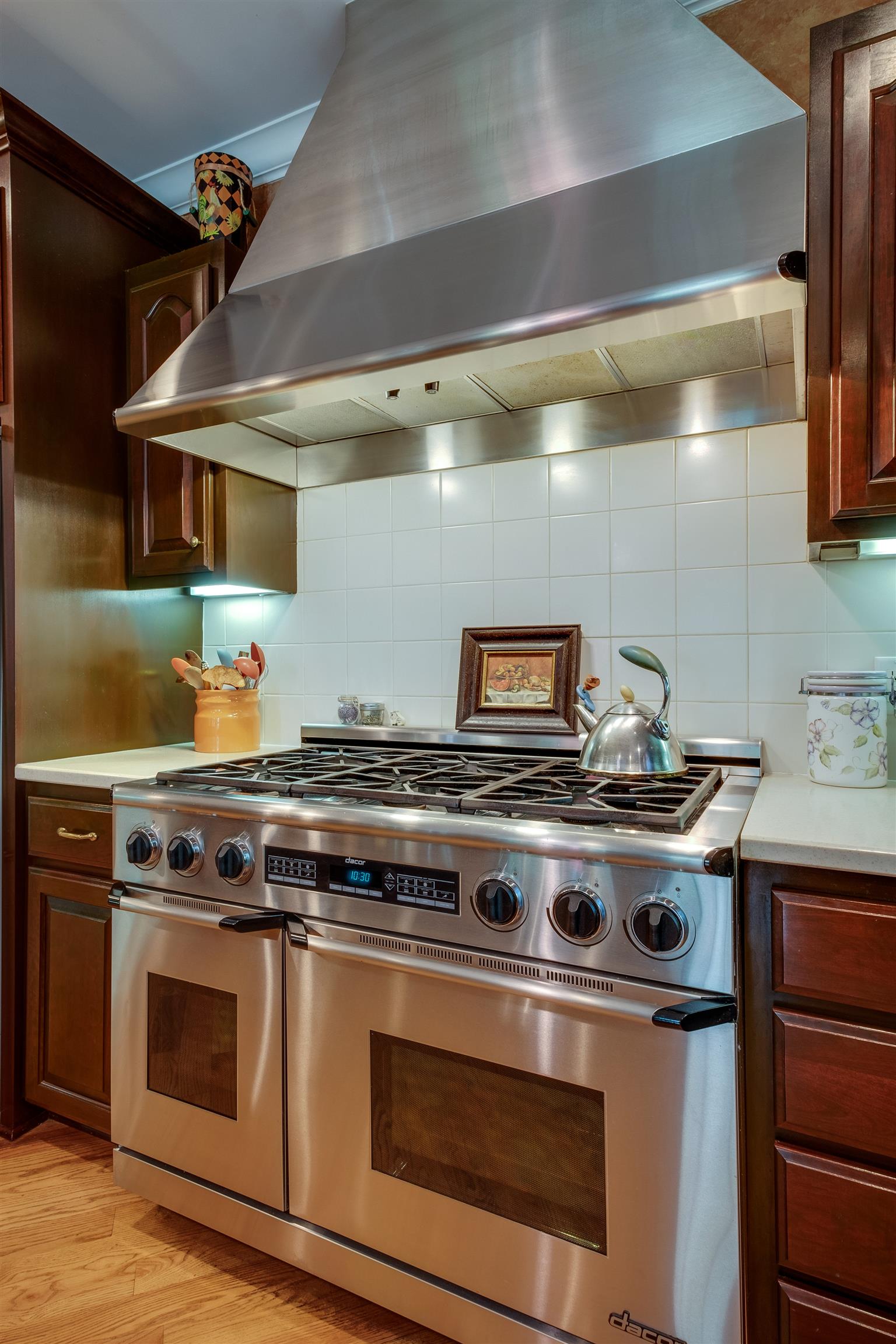 7446 River Rd Pike Nashville, TN 37209 - Photo 10 of 30 a stove top oven sitting inside of a kitchen