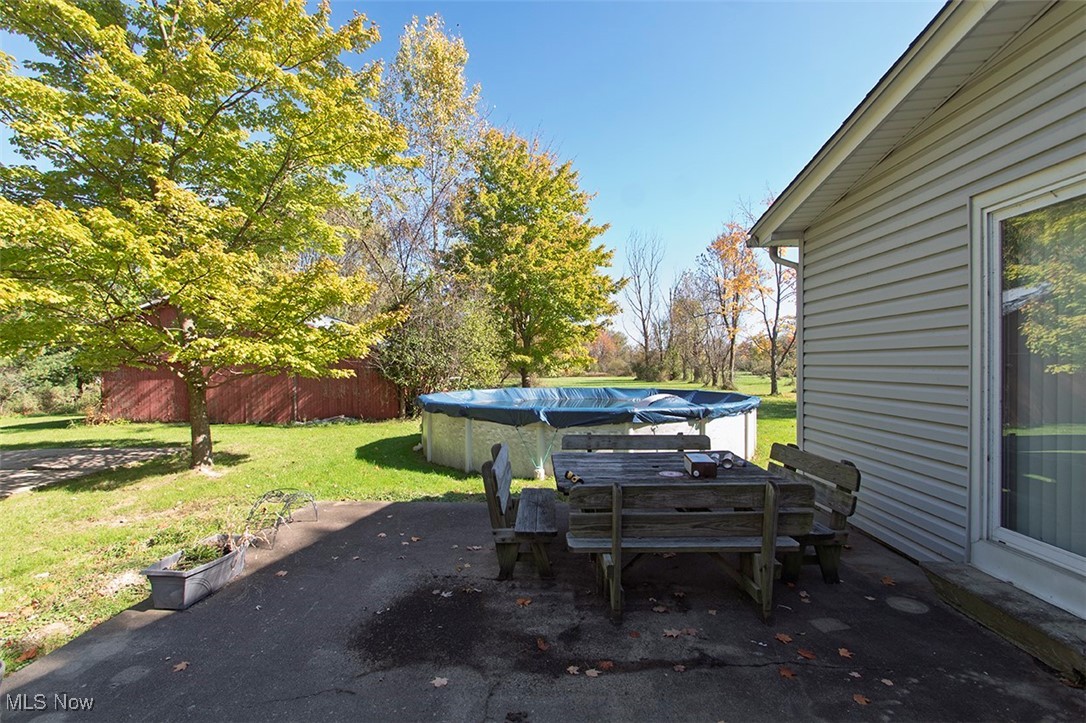 3555 Marks Road Medina, OH 44256 - Photo 14 of 19 View of patio / terrace with a covered pool