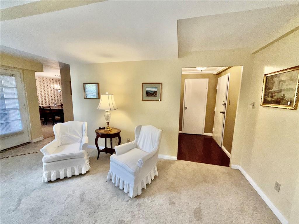 4601 Fifth Avenue, Unit 521 Pittsburgh, PA 15213 - Photo 3 of 13 a living room with furniture and a potted plant