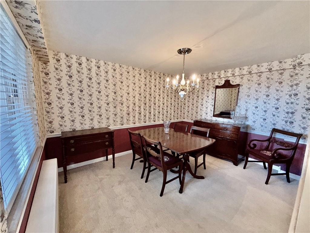4601 Fifth Avenue, Unit 521 Pittsburgh, PA 15213 - Photo 7 of 13 a view of a livingroom with furniture and a lamp