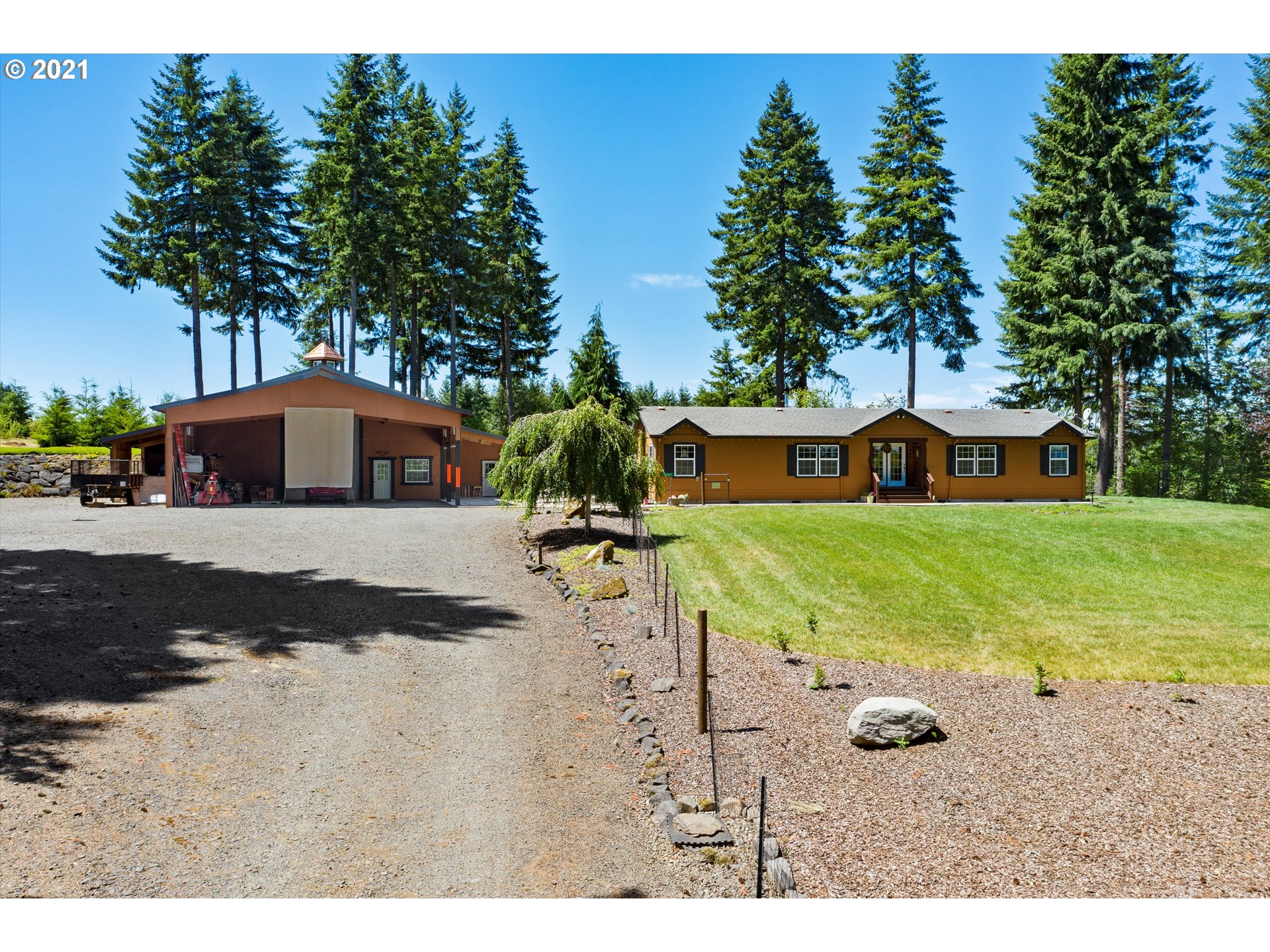 19887 South Mosier Road Oregon City, OR 97045 - Photo 1 of 22 a view of an house with backyard space and garden