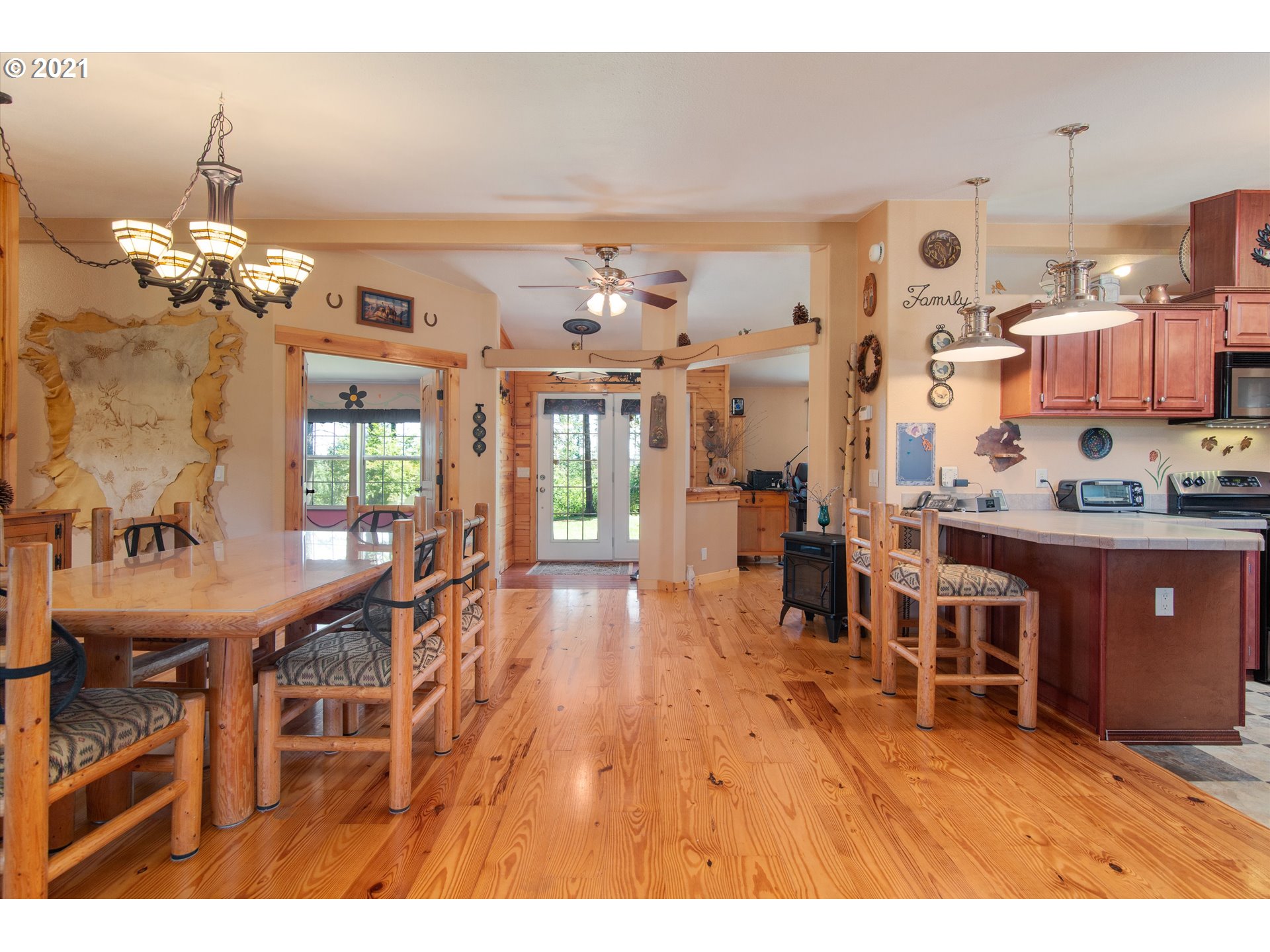 19887 South Mosier Road Oregon City, OR 97045 - Photo 11 of 22 a living room with stainless steel appliances kitchen island granite countertop furniture and a kitchen view