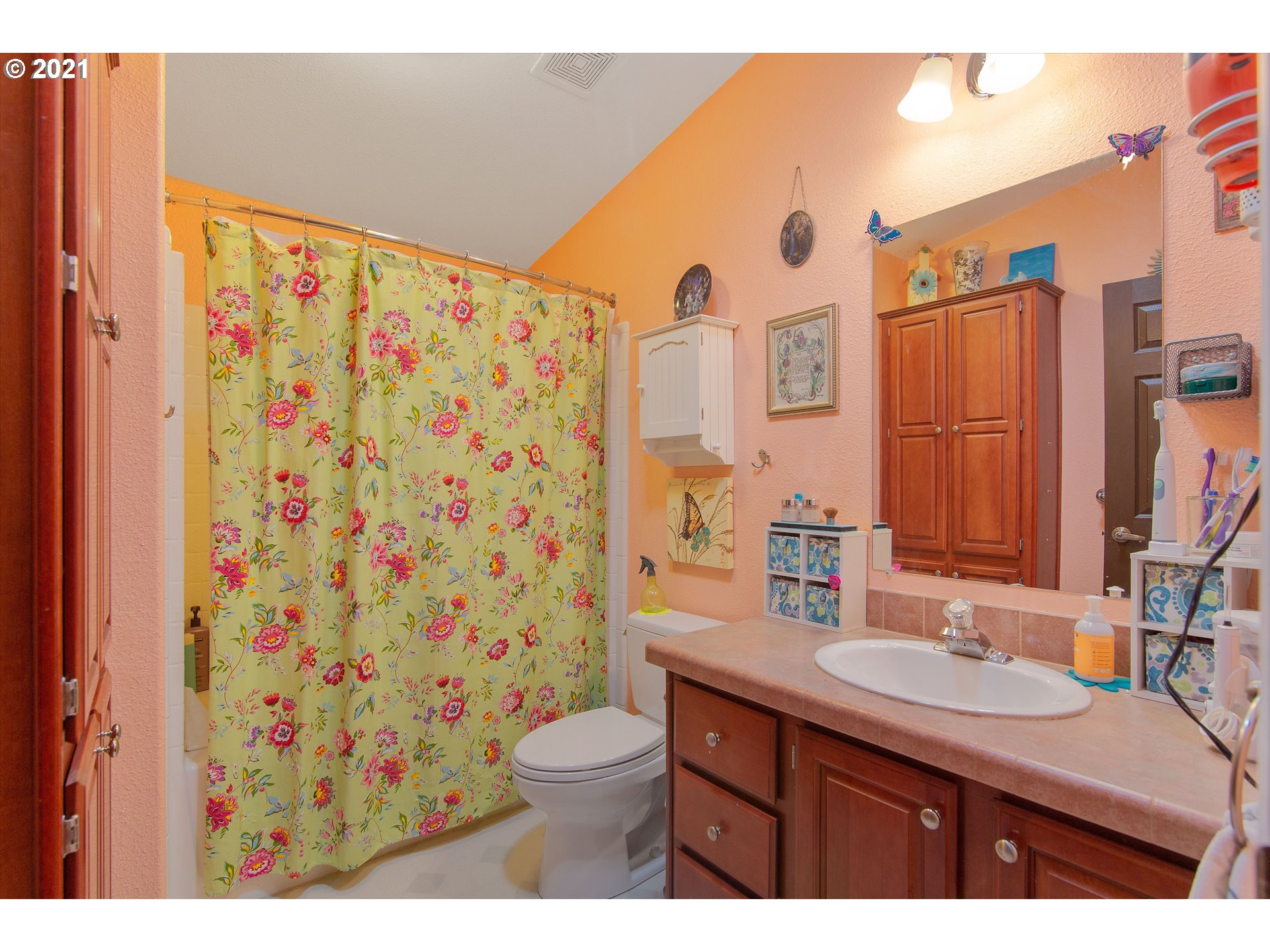 19887 South Mosier Road Oregon City, OR 97045 - Photo 16 of 22 a bathroom with a granite countertop sink and a mirror
