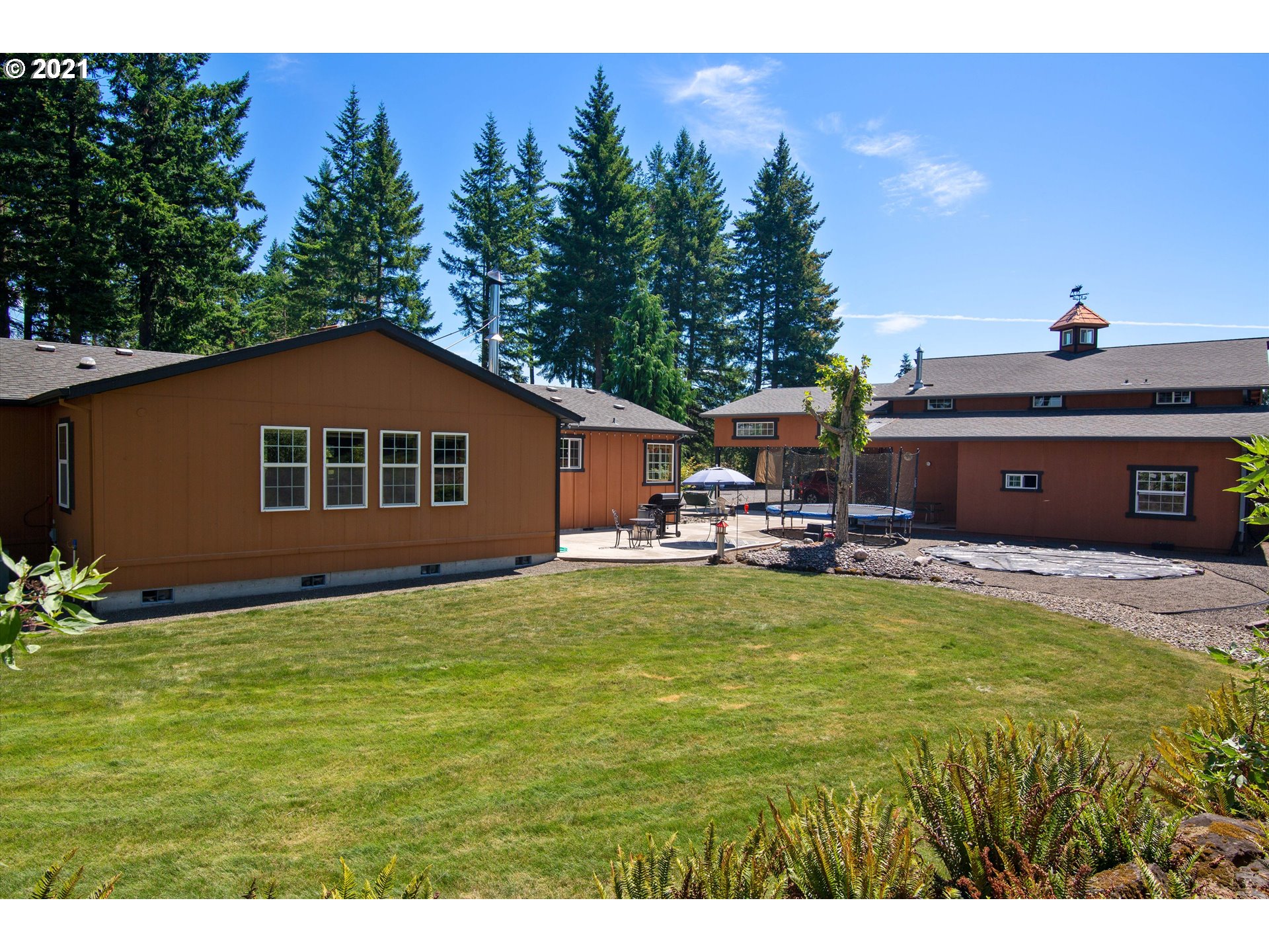 19887 South Mosier Road Oregon City, OR 97045 - Photo 7 of 22 a swimming pool with outdoor seating and yard