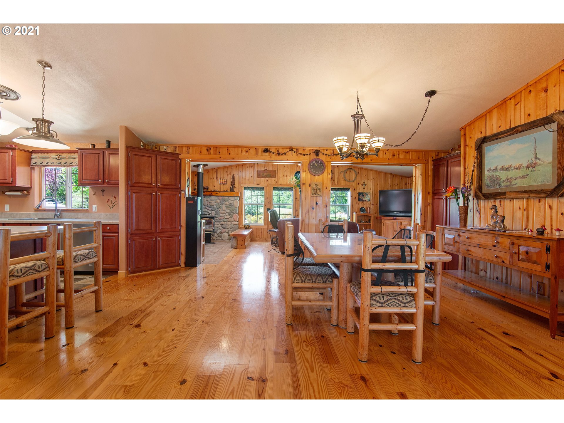 19887 South Mosier Road Oregon City, OR 97045 - Photo 8 of 22 a view of a dining room with furniture and wooden floor