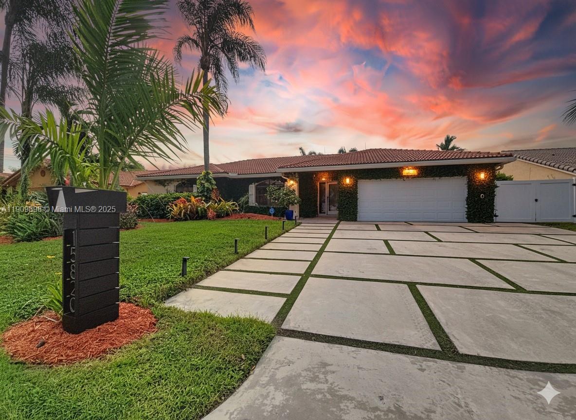a backyard of a house with yard and outdoor seating