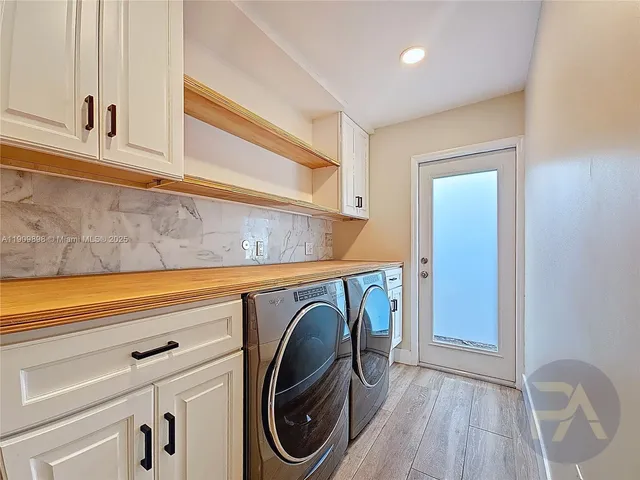 a utility room with dryer and washer