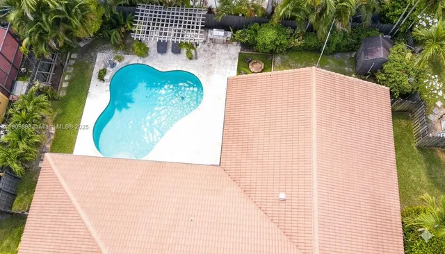 a view of a swimming pool with a patio
