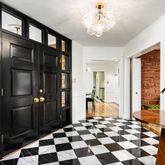 a view of a entryway with furniture and front door